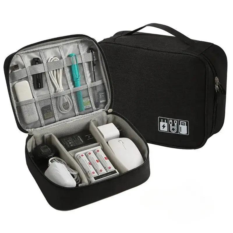 Black travel organizer with electronic devices inside on a white background