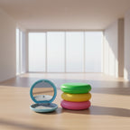 Colorful compact mirror and case set on a white background