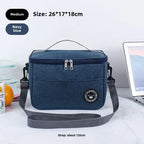 Navy blue cooler bag with strap on a white surface, size and strap length information displayed.