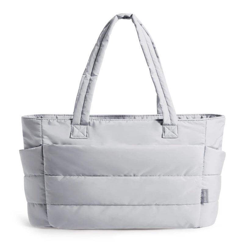 Gray tote bag with multiple compartments on a white background
