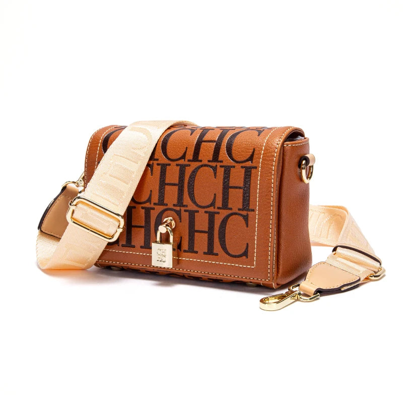 Brown handbag with beige strap and 'CHC' branding on a white background