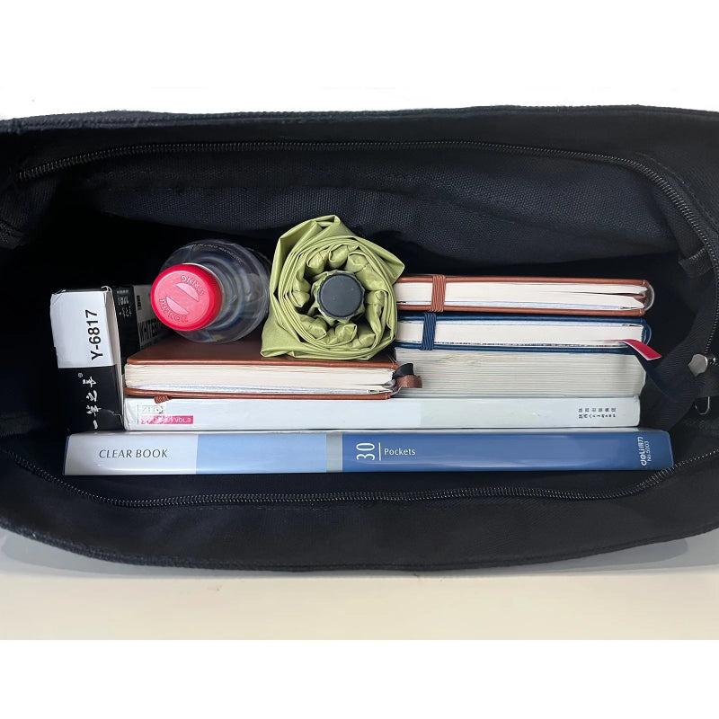 Black bag with books, a bottle, and an umbrella inside