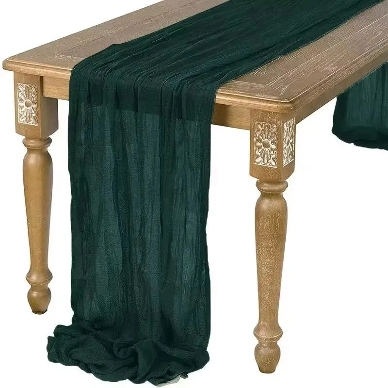 Dark green table runner draped over a wooden table