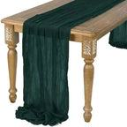 Dark green table runner draped over a wooden table