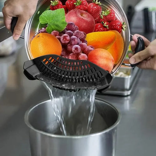 Fruit and vegetable chopper with fruits being chopped and water being poured into a pot.