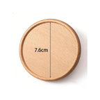 Wooden coaster with measurement label on a white background