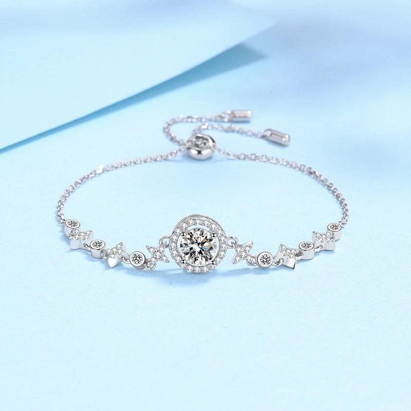 Silver bracelet with decorative elements on a light blue background