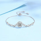 Silver bracelet with decorative elements on a light blue background