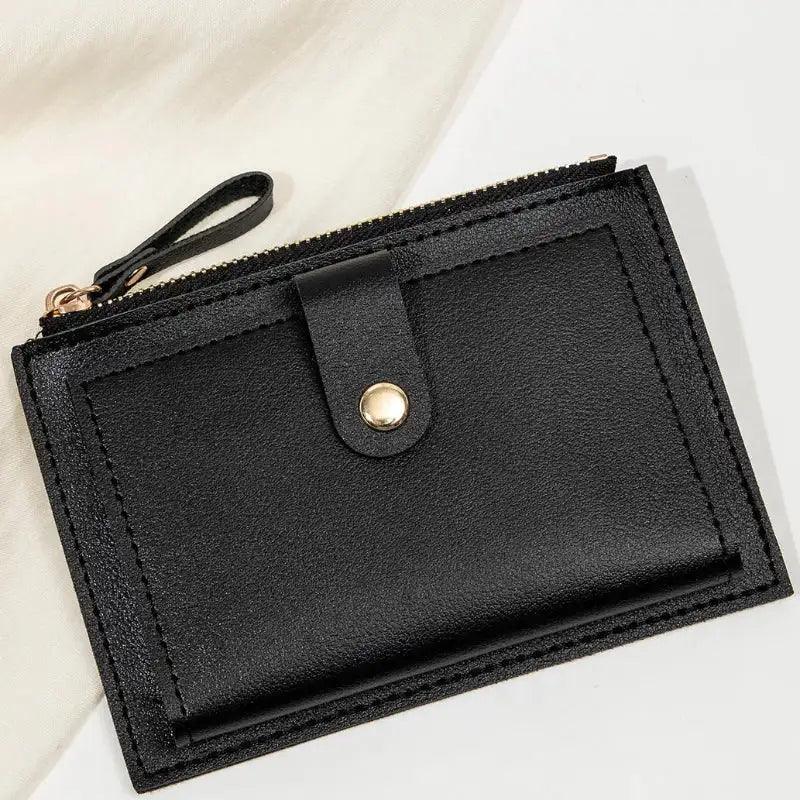 Black wallet with a zipper on a light background
