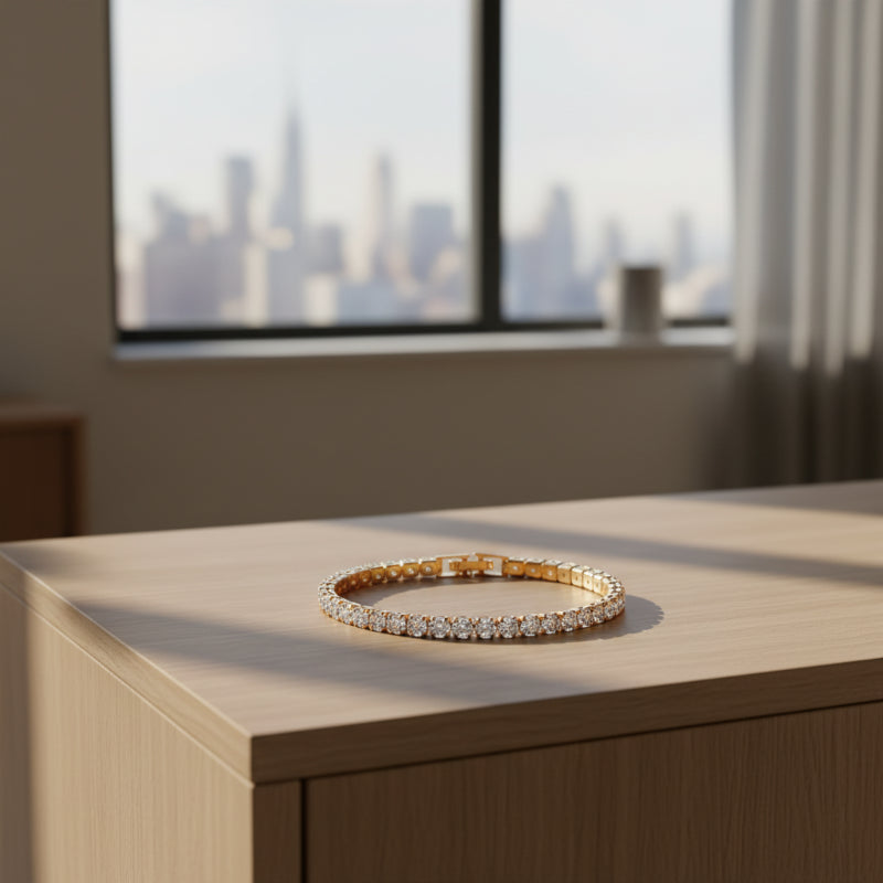 Gold bracelet with clear stones on a white background