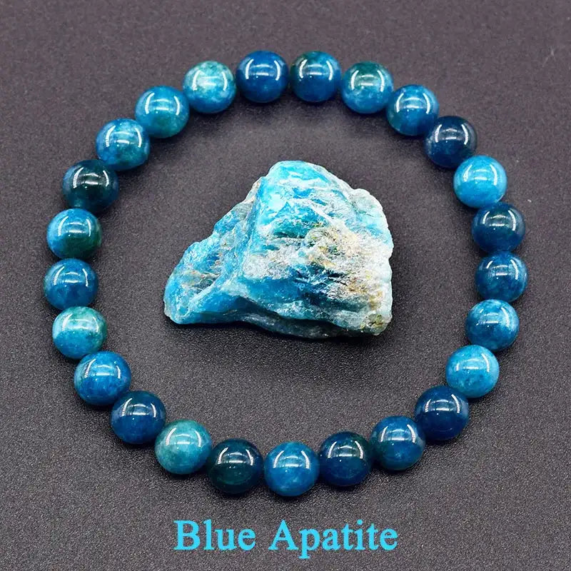 Blue apatite bracelet with a rough stone on a dark background