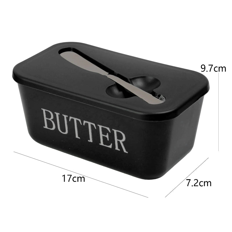 Navy blue butter container with a knife on a white background