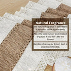 Linen table runner with natural fragrance information on a wooden surface