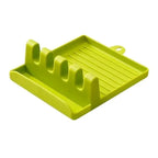 Green silicone dish drying rack on a white background