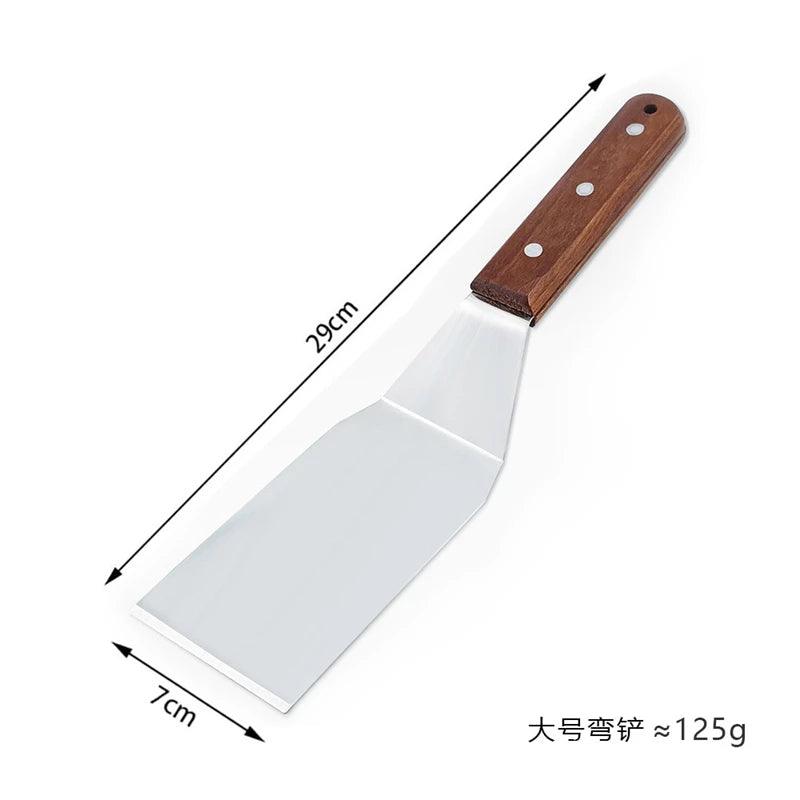 Measuring tool showing a spatula with a wooden handle and metal blade, labeled with dimensions and weight.