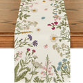 Floral patterned table runner on a wooden surface