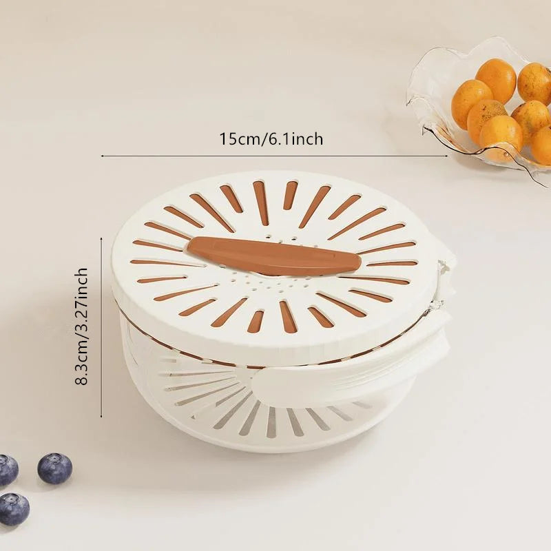 White kitchen tool with brown accents on a light beige background, showing measurements and a small bowl of oranges.