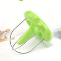 Green kitchen tool on a white background