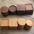 Set of wooden coasters in various shapes and sizes on a wooden surface