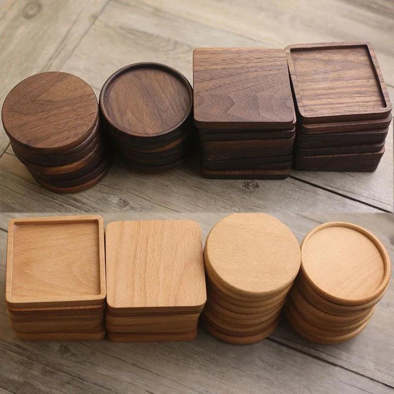Set of wooden coasters in various shapes and sizes on a wooden surface