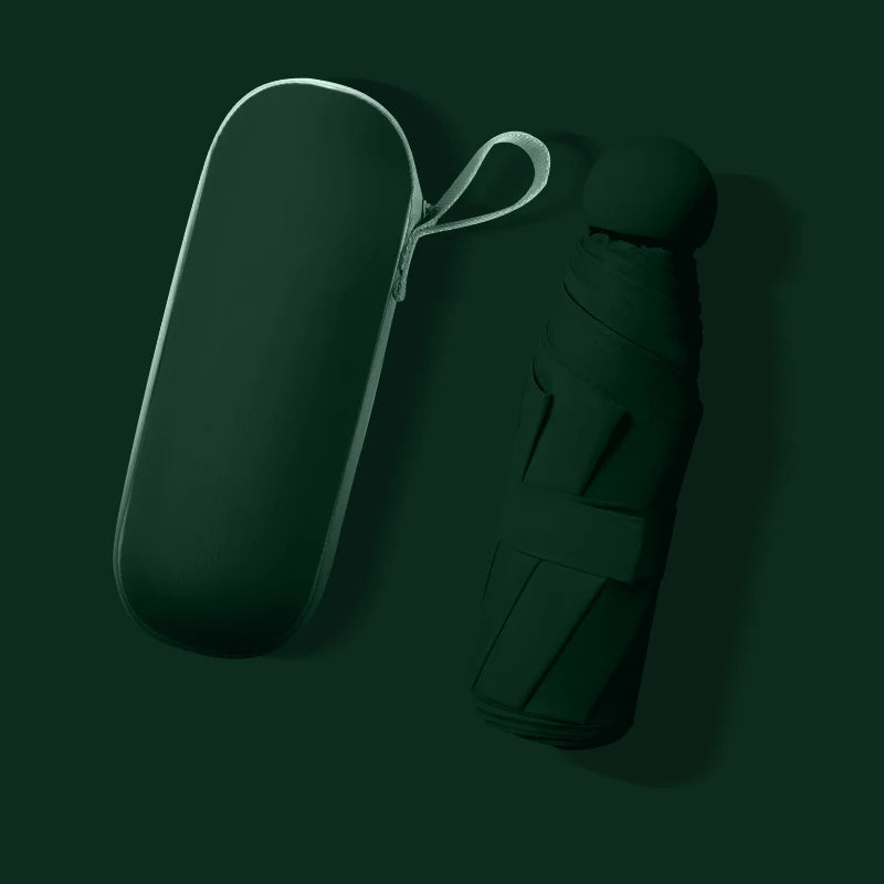 A dark green compact umbrella shown next to its matching hard-shell carrying case on a dark green background.