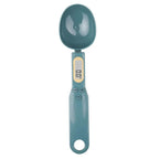 Teal digital measuring spoon on a white background