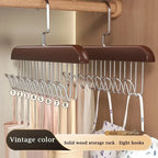 Wooden hanger with eight hooks on a wooden background