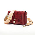 Red handbag with beige strap and 'CHIC' text on a white background