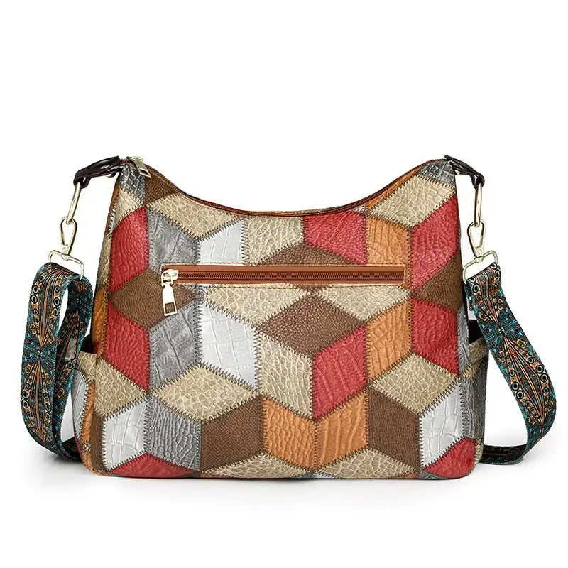 Multicolored patchwork handbag with geometric pattern on a white background