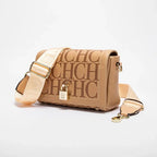 Beige handbag with gold accents on a light gray background