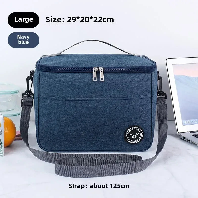 Navy blue cooler bag with strap on a white background