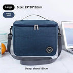Navy blue cooler bag with strap on a white background