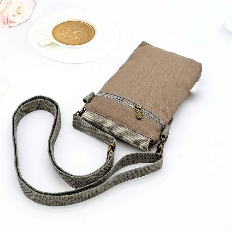Beige crossbody bag with a strap on a white background