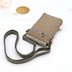 Beige crossbody bag with a strap on a white background