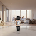 Black rectangular watch with rose gold frame and white face on a white background, featuring the brand 'SANDA'.