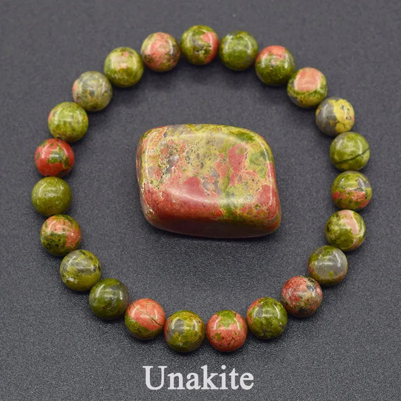Unakite stone bracelet on a dark background with 'Unakite' text.