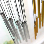 Metallic straws in silver and gold on a blurred background
