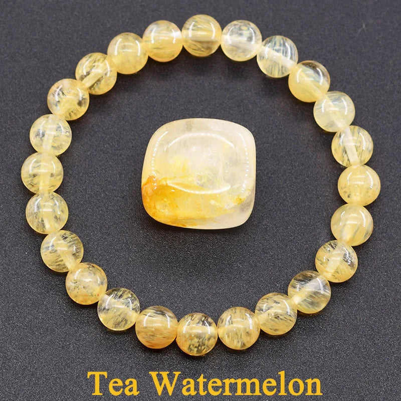 Tea Watermelon gemstone bracelet on a dark background