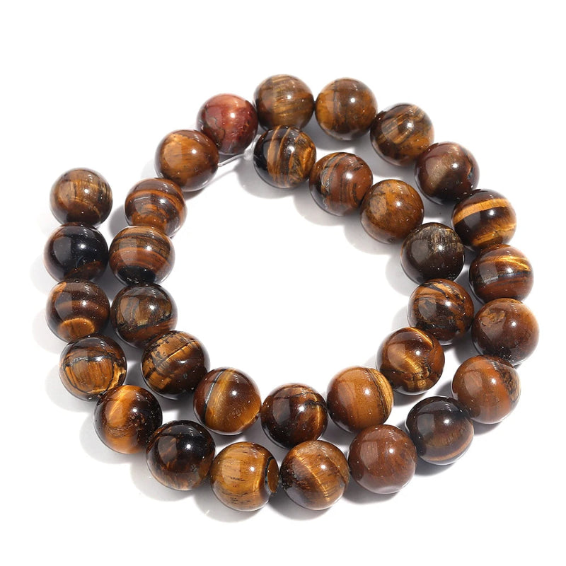 A beaded bracelet made of polished round tiger's eye beads, arranged in a double loop on a clean white background.