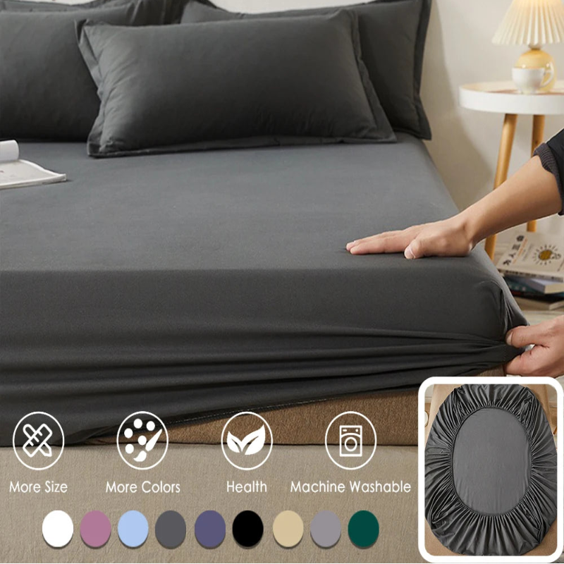 Gray bedding set on a bed with '100% Cotton Vave' branding, showing a hand adjusting the fitted sheet.
