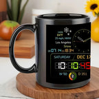 Black mug with digital display showing weather and time information on a wooden surface.