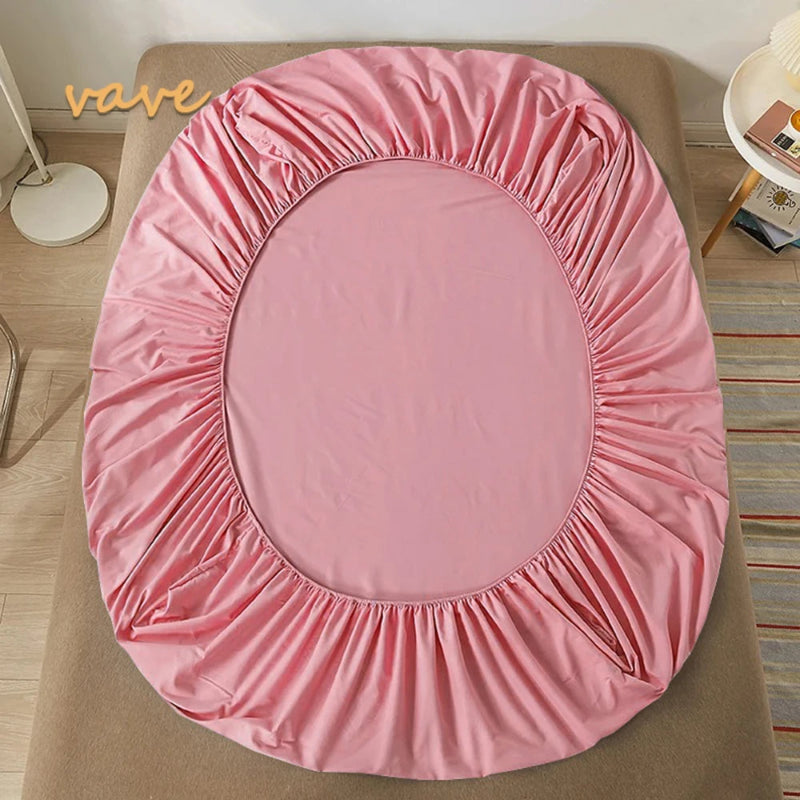 Pink round mattress cover on a wooden bed frame with 'vave' branding.