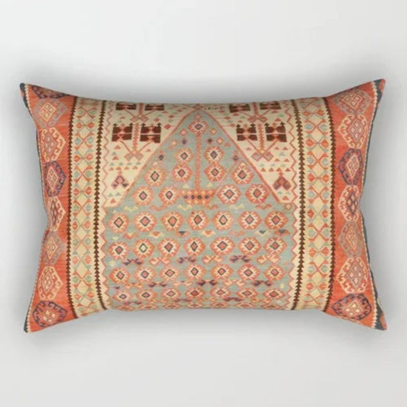 Decorative pillow with geometric pattern on a light gray background