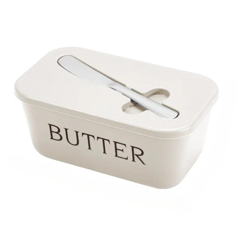 Beige butter dish with a lid on a white background