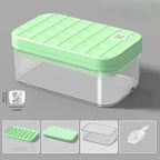 Green silicone ice cube tray with clear container on a gray background