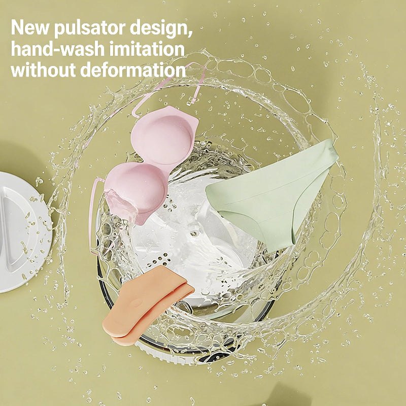 Pink, green, and orange bras with water splashes on a beige background