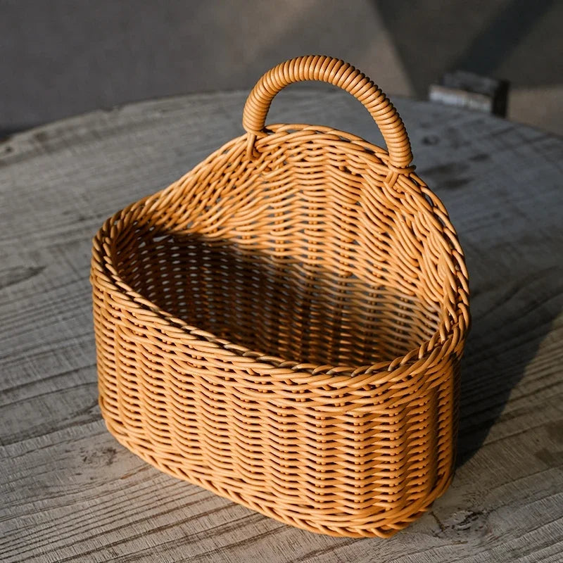 Wicker basket with a handle on a wooden surface