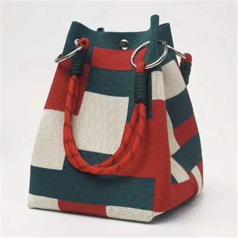 Colorful striped handbag with a white background