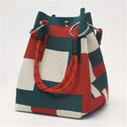 Colorful striped handbag with a white background