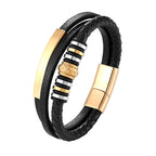 Black leather bracelet with gold and silver accents on a white background